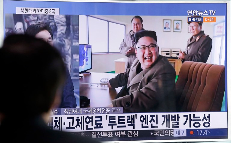 A man watches a TV news program showing an image of North Korean leader Kim Jong Un at the country's Sohae launch site, at Seoul Railway station in Seoul, South Korea, Sunday, March 19, 2017. (AP Photo/Ahn Young-joon)
