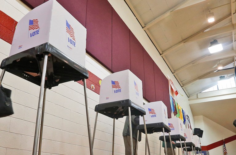 Two women in Florida and a Virginia man are facing voter fraud charges in separate cases. (AP Photo/Steve Helber)