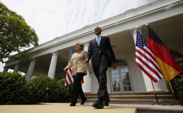 President Barack Obama and German Chancellor Angela Merkel arrive for their joint news conference in the Rose Garden of the White House in Washington, Friday, May 2, 2014. Obama and Merkel are putting on a display of trans-Atlantic unity against an assertive Russia, even as sanctions imposed by Western allies seem to be doing little to change Russian President Vladimir Putin's reasoning on Ukraine. (AP Photo/Charles Dharapak)