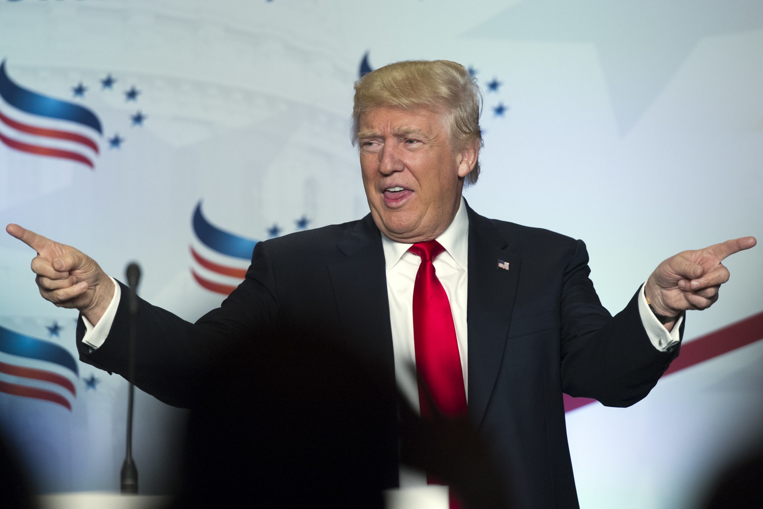 Trump raises his Bible high at evangelical forum