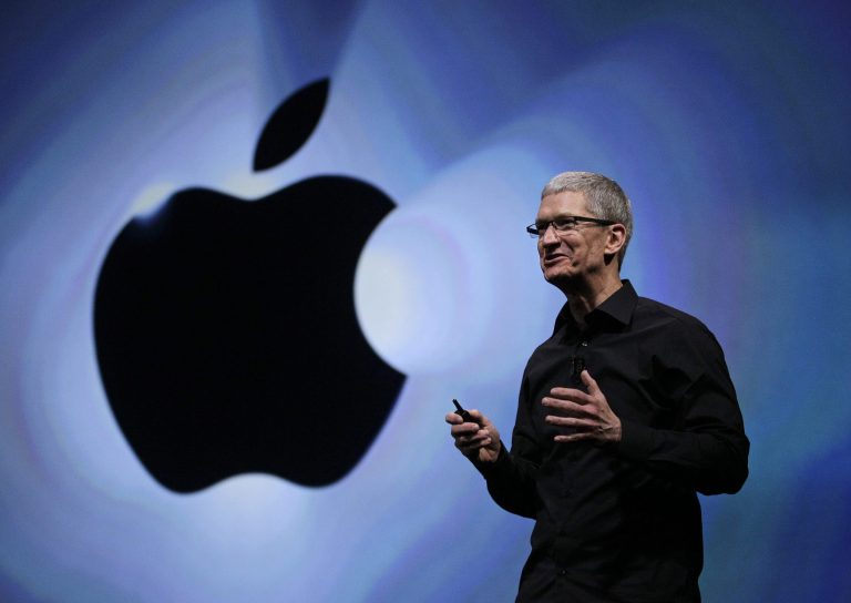   FILE - In this Wednesday, Sept. 12, 2012, file photo, Apple CEO Tim Cook speaks following an introduction of the new iPhone 5 in San Francisco. Apple is emerging as a gentler, cuddlier corporate citizen in the year after the death of CEO and co-founder Steve Jobs. CEO Tim Cook's announcement that the company is moving a Mac production line to the U.S. is just the latest step in a charm offensive designed to soften Apple's image. (AP Photo/Eric Risberg)  