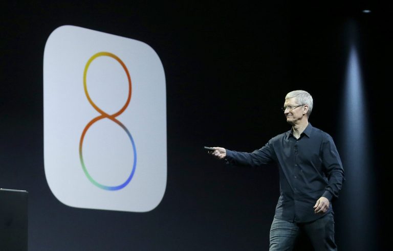 Apple CEO Tim Cook speaks about iOS 8 at the Apple Worldwide Developers Conference in San Francisco, Monday, June 2, 2014. (AP Photo/Jeff Chiu)