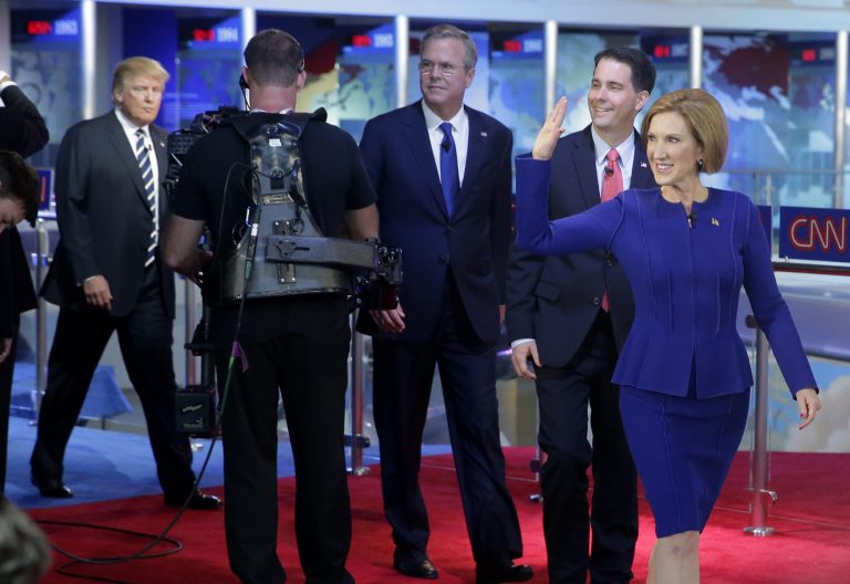 Republican presidential candidate, businesswoman Carly Fiorina, right, leads fellow candidates as they take the stage prior to the CNN Republican presidential debate onÂ Sept. 16, 2015, in Simi Valley, Calif. (AP Photo/Chris Carlson)
