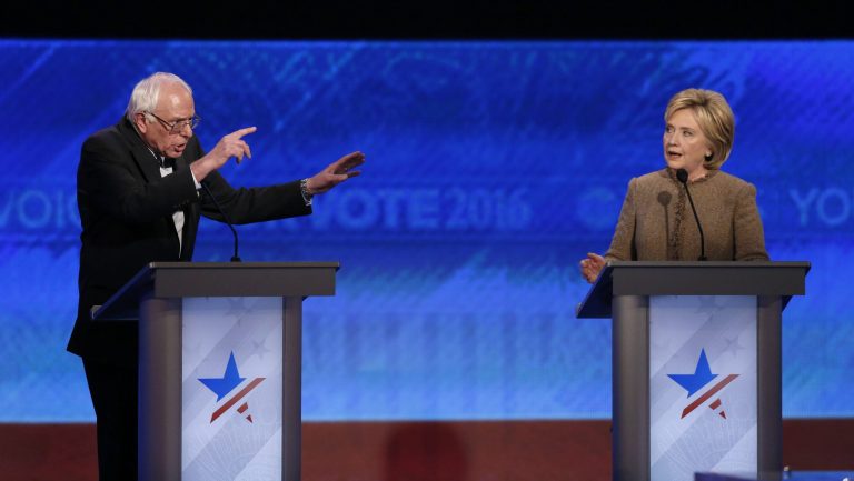 Bernie Sanders and Hillary Clinton speak during the Democratic presidential primary debate on Dec. 19 at Saint Anselm College in Manchester, N.H. (AP Photo)