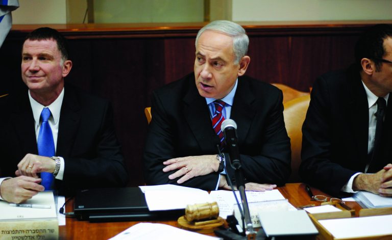 Israeli Prime Minister Benjamin Netanyahu, center, heads the weekly Cabinet meeting at his Jerusalem office, Sunday, Jan. 27, 2013. Sitting left is Cabinet minister Yuli Edelstein. (AP Photo/Ariel Schalit)