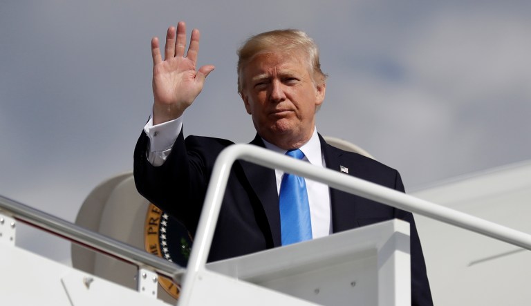 President Trump waves as he prepares to board Air Force One for a trip to Dallas. (AP Photo/Evan Vucci)