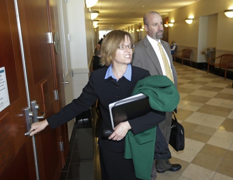 Assistant Utah Attorney's General Joni Jones, left, and David Wolf, right, arrive to court Tuesday, March 5, 2013, in Salt Lake City. A 3rd District Judge has given initial approval for the eventual creation of a board of trustees to take over homes and property belonging to a polygamous sect led by Warren Jeffs on the Utah-Arizona border. Judge Denise Lindberg approved the plan during a hearing Tuesday morning in Salt Lake City. Her approval is not a final decision, but rather permission to explore this option. Any action is pending the Utah legislature paying $5.7 million it owes in professional fees to a trust created in 2005 to handle the properties. (AP Photo/Rick Bowmer)