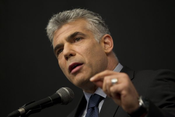 Lapid: Gaza aid should be tied to restored PA rule