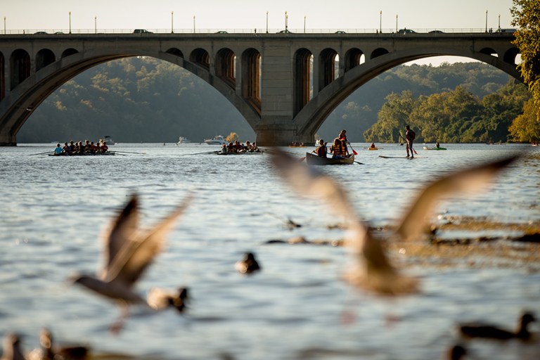Key Bridge is visible as rowers on the Potomac River make their way along the Georgetown Waterfront, Monday, Oct. 12, 2015, in Washington. (AP Photo/Andrew Harnik)