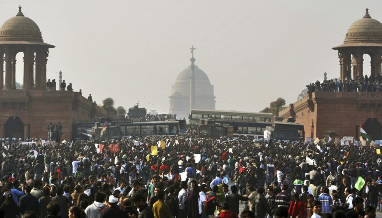 FILE - In this Dec. 22, 2012 file photo, protesters gather outside the Indian Presidential Palace during a rally against the gang rape and brutal beating of a 23-year-old student on a moving bus in New Delhi, India. A New Delhi court has confirmed the death penalty imposed by a lower court to four men convicted for the gang rape and murder of the young woman in December 2012. (AP Photo/Tsering Topgyal, File)