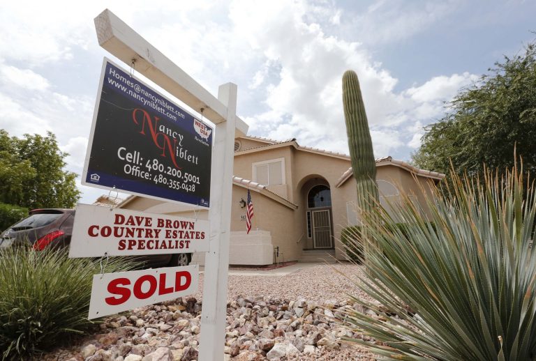 FILE - In this Thursday, Aug. 22, 2013, file photo, an existing home is listed as sold, in Gilbert, Ariz. Freddie Mac, on Wednesday, Nov. 27,  2013, reports on mortgage rates for the week. (AP Photo/Matt York, File)