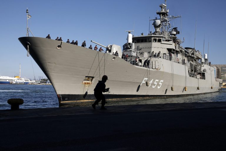 Greek frigate Salamis arrives at a port of Piraeus, near Athens, Greece, on Saturday, Aug. 2, 2014. The Greek navy frigate carrying embassy staff and nearly 200 people from Greece, China and other countries evacuated from the conflict in Libya returned early Saturday to the port. The Greek Defense Ministry the ship transported 77 people from Greece, 78 from China, 10 from Britain, seven from Belgium, one each from Russia and Albania. (AP Photo/Petros Giannakouris)