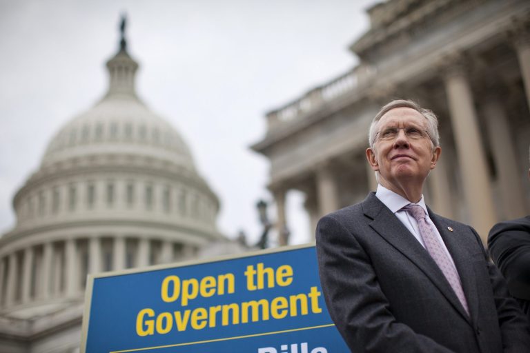 Senate Majority Leader Harry Reid of Nev. stands on the Senate steps on Capitol Hill in Washington, Wednesday, Oct. 9, 2013, during a news conference on the ongoing budget battle. President Barack Obama was making plans to talk with Republican lawmakers at the White House in the coming days as pressure builds on both sides to resolve their deadlock over the federal debt limit and the partial government shutdown.  (AP Photo/ Evan Vucci)