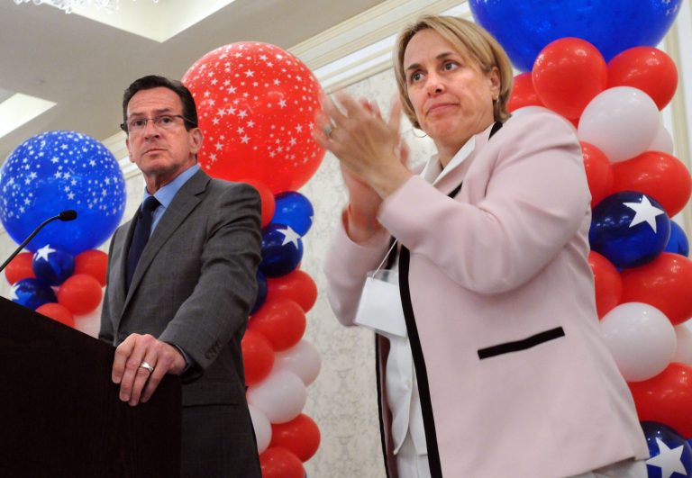Governor Dannel P. Malloy addresses the Connecticut AFL-CIO  political convention held at rhe Omni Hotel in New Haven, Conn., Monday June 16, 2014. At right is Lori Pelletier, executive secretary/treasurer for the Connecticut  AFL-CIO.  (AP Photo/The New Haven Register, Mara Lavitt)   mlavitt@newhavenregister.com