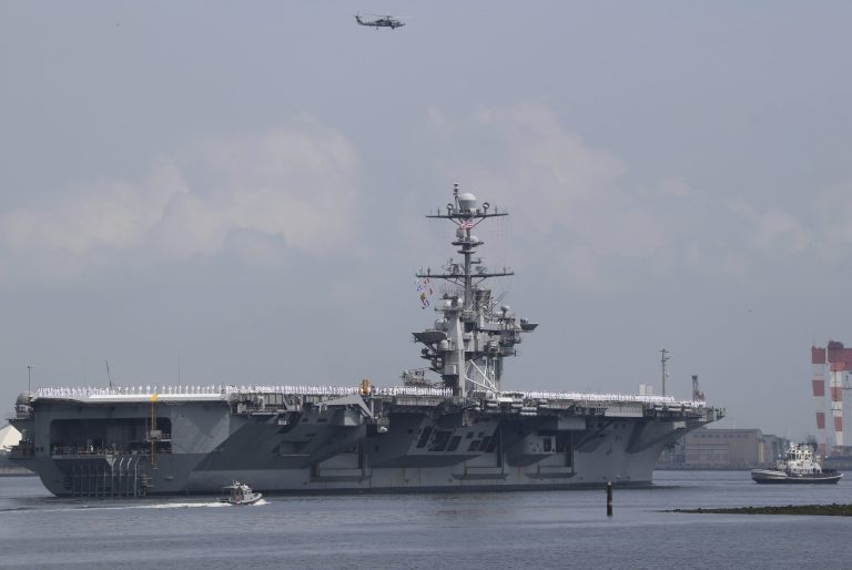 USS George Washington leaves the U.S. Navy's Yokosuka base in Yokosuka, near Tokyo Monday, May 18, 2015. (AP Photo/Koji Sasahara)
