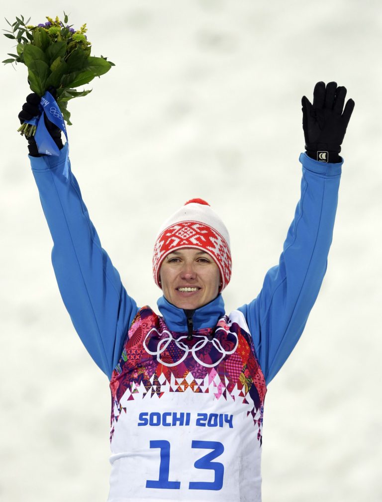 Alla Tsuper of Belarus celebrates after winning the gold medal in the women's freestyle skiing aerials final at the Rosa Khutor Extreme Park, at the 2014 Winter Olympics, Friday, Feb. 14, 2014, in Krasnaya Polyana, Russia. Tsuper won the gold medal.  (AP Photo/Andy Wong)
