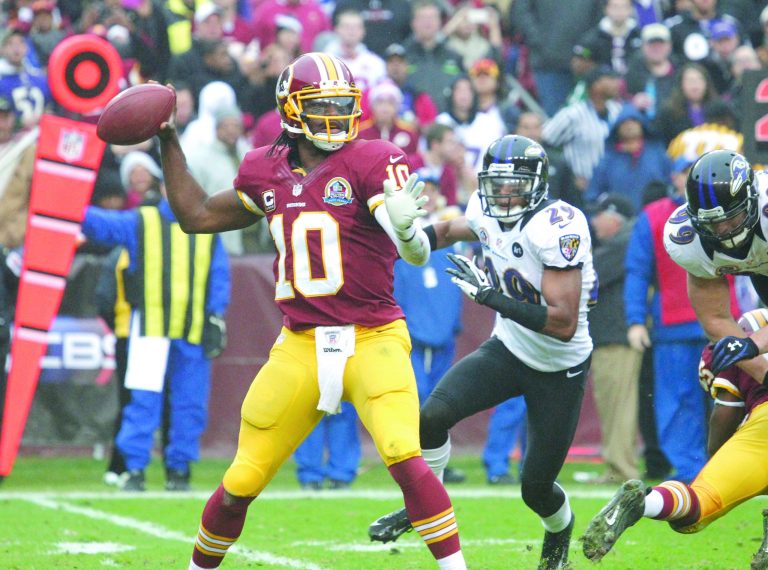 Jennifer Milbrett/The Washington Examiner
Quarterback Robert Griffin III wouldn't say whether he would play Sunday because he didn't 