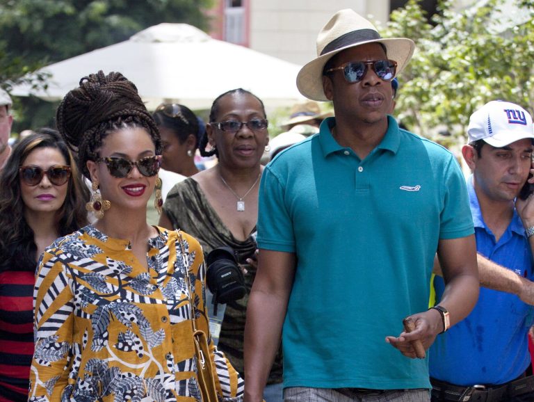 FILE - This April 4, 2013 file photo shows married musicians Beyonce, left, and rapper Jay-Z as they tour Old Havana, Cuba. Jay-Z is addressing his recent trip to Cuba in a new song. The rapper released 