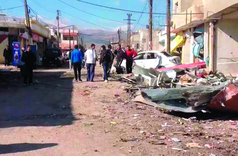 In this photo released by the Syrian official news agency SANA, a damaged area is seen after a car bomb explosion in Qatana, (25) kilometers (15 miles) southwest of Damascus, Syria, Thursday, Dec. 13, 2012. A bomb blast near a school in a Damascus suburb killed more than a dozen people, at least half of them women and children, the state news agency reported. Russia, Syria's most important international ally, said for the first time that President Bashar Assad is increasingly losing control and the opposition may win the civil war. (AP Photo/SANA)