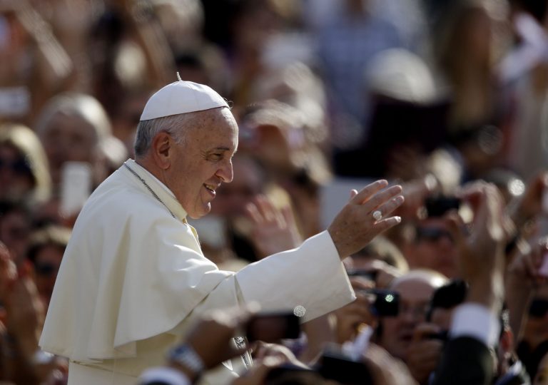 Pope Francis blesses faithful upon his arrival for the weekly general audience in St. Peter's Square at the Vatican, Wednesday, Oct. 1, 2014. (AP Photo/Gregorio Borgia)