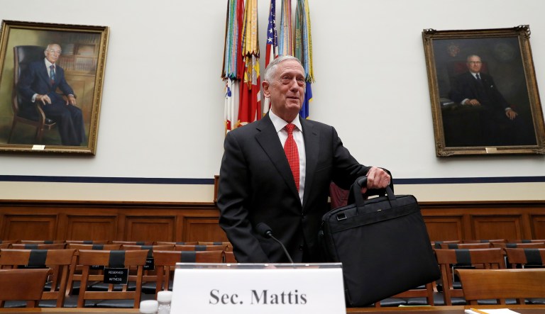 Defense Secretary Jim Mattis sets his briefcase down before he testifies at a House Armed Services Committee hearing on the defense budget for the 2018 budget year, on Capitol Hill, Monday, June 12, 2017, in Washington. (AP Photo/Alex Brandon)