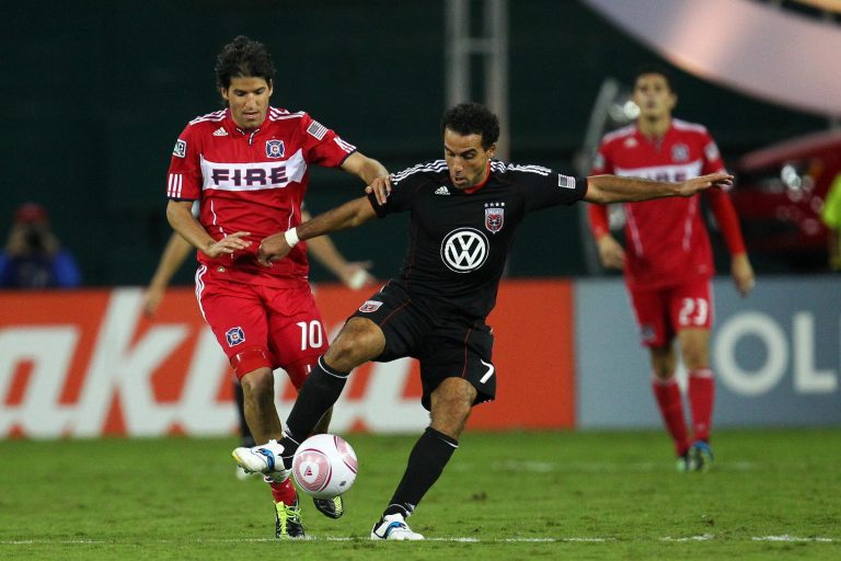 Dwayne De Rosario of D.C. United controls the ball against Sebastian Grazzini of the Chicago Fire at RFK Stadium on October 15, 2011 in Washington, DC. 