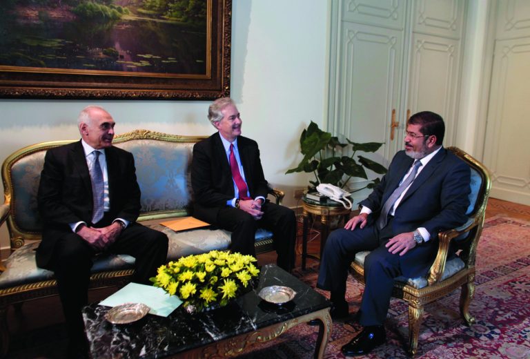Egyptian Foreign Minister Mohammed Kamel Amr, left, meets woth U.S. Undersecretary of State William Burns, center, and President Mohammed Morsi, right, at the Presidential palace in Cairo, Egypt, Sunday, July 8, 2012. Morsi is the country's first democratically-elected president, first Islamist, and civilian to take office in Egypt. He was sworn in last week. (AP Photo/Maya Alleruzzo)