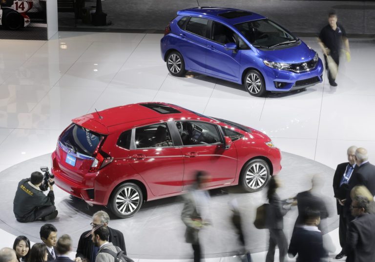 FILE - In this April 17, 2014, file photo, the 2015 Honda Fit is displayed at the New York International Auto Show in New York. For the first time, the Fit can be fitted with premium amenities like heated and leather-covered seats, push-button start, moonroof and a 7-inch information display screen in the dashboard with navigation system and voice controls. (AP Photo/Mark Lennihan, File)