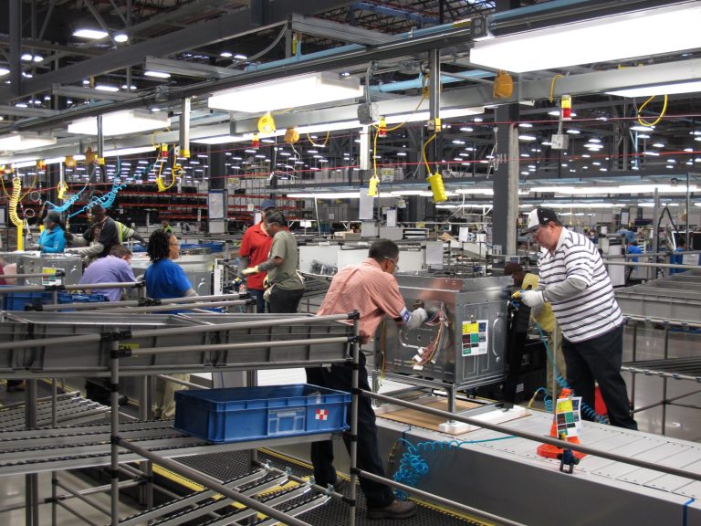 FILE - In this Thursday, Jan. 9, 2014, file photo, workers assemble ovens at the new Electrolux home cooking appliance factory in Memphis, Tenn.  The Institute for Supply Management releases its manufacturing index for January on Monday, Feb. 3, 2014. (AP Photo/Adrian Sainz, File)