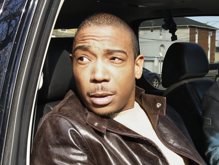 FILE - This March 22, 2011 file photo shows rapper Ja Rule inside a vehicle outside Martin Luther King, Jr. Courthouse after pleading guilty to federal tax evasion charges in Newark, N.J. The Federal Bureau of Prisons says Ja Rule, whose real name is Jeffrey Atkins, left a correctional facility in New York's Adirondacks on Tuesday, May 7, 2013, though time remains on his sentence. Ja Rule had served most of a two-year sentence for illegal gun possession in a New York state prison before his release in February and subsequent transfer into federal custody in the tax evasion case. (AP Photo/Julio Cortez, file)