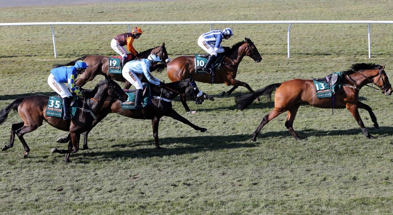 Auroras Encore, left, riden by Ryan Mania goes on to win after jumping Becher's Brook during the Grand National horse race at Aintree Racecourse, Liverpool, England, Saturday April 6, 2013. (AP Photo/Scott Heppell)