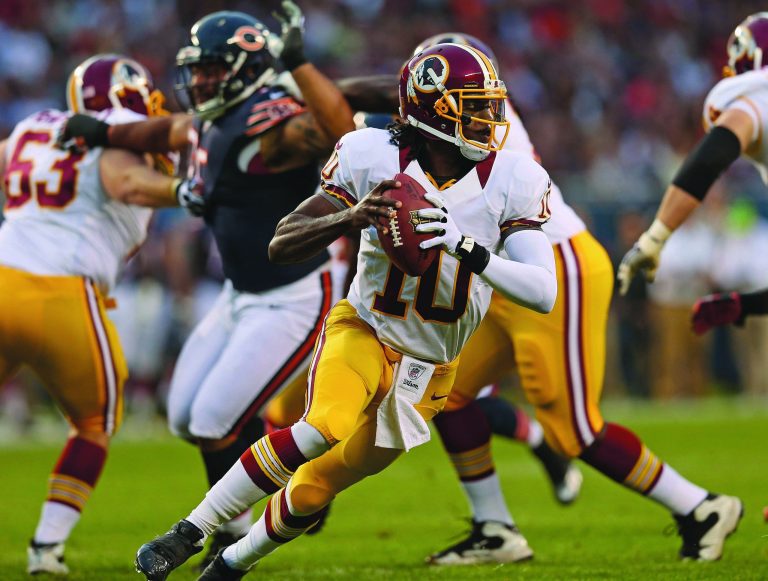 Jonathan Daniel/Getty Images
Washington Redskins rookie quarterback Robert Griffin III fumbled once against the Chicago Bears on Saturday night.