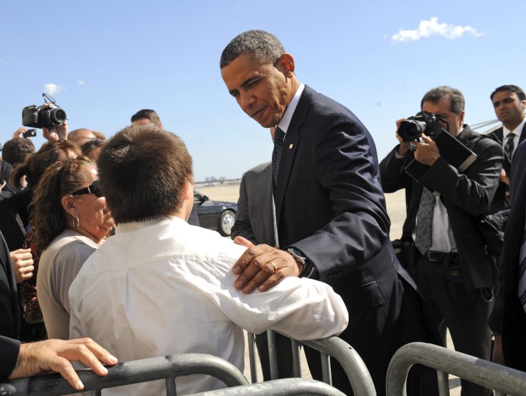 President Barack Obama greets Joshua Alvarez, 13, from Nassau County as he  arrives at JFK International Airport on Air Force One in New York to address the UN General Assembly, Monday, Sept. 24, 2012. (AP Photo/ Louis Lanzano)