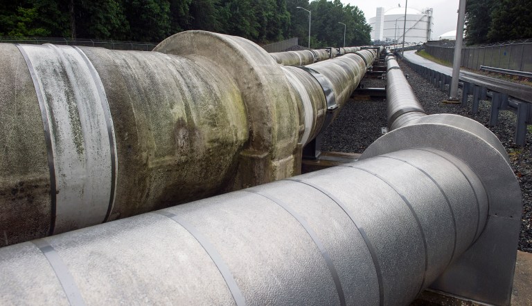 Pipes carrying liquified natural gas to and from a holding tank at Dominion Energy's Cove Point LNG Terminal in Lusby, Md. Dominion announced Wednesday that its Cove Point export terminal was beginning production. (AP Photo/Cliff Owen, File)
