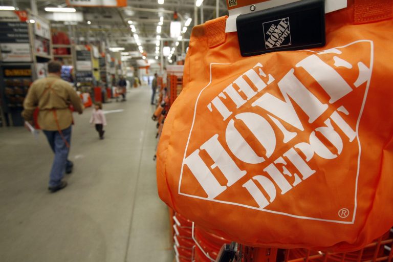 FILE - In this Feb. 22, 2010 file photo, shoppers walk through the aisles at the Home Depot store in Williston, Vt. The Home Depot on Thursday, Sept. 18, 2014 said it has eliminated malware from its U.S. and Canadian networks that affected 56 million unique payment cards between April and September.