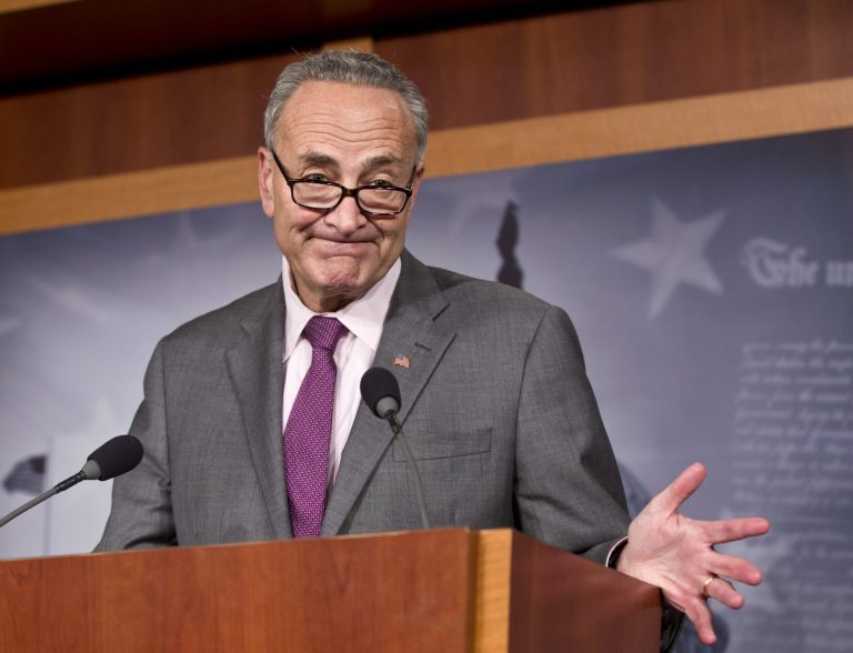 The Drudge Report ran an image from 2003 on its front-page Friday afternoon showing Sen. Chuck Schumer, D-N.Y., sharing a donut and a cup of coffee with Russian President Vladimir Putin. (AP Photo/J. Scott Applewhite)
