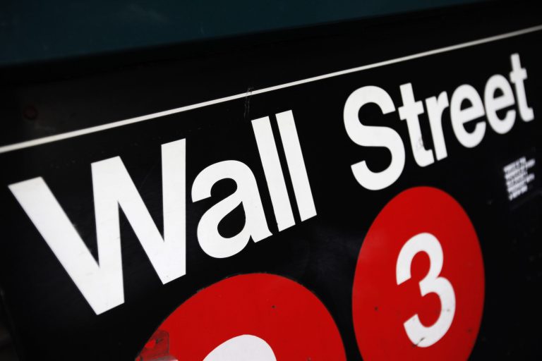 FILE - This Jan. 4, 2010 file photo shows an entrance to a Wall Street subway station in New York. European and some Asian stock markets rallied Thursday June 19, 2014 after the Fed signaled that U.S. interest rates would remain at record lows.   (AP Photo/Mark Lennihan, File)