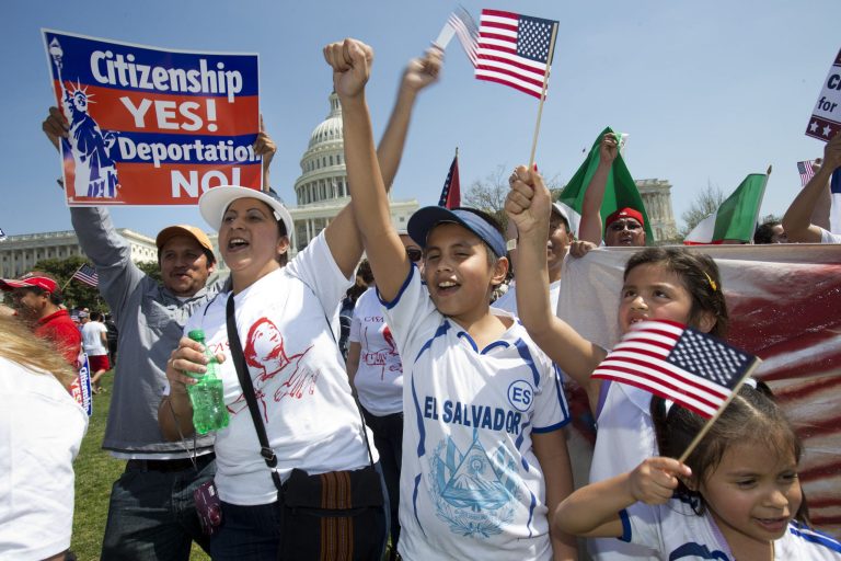 Adita Chicas, left, and her son Jessy Chicas, 10, of Woodbridge, Va., cheer as they arrive at the 