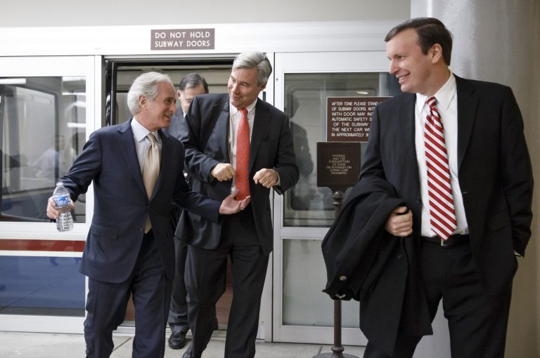 From left, Sen. Bob Corker, R-Tenn., Sen. Sheldon Whitehouse, D-R.I., and Sen. Chris Murphy, D-Conn., arrive for a procedural vote in the Senate on a bill that would extend unemployment benefits, at the Capitol in Washington on Monday. (AP/J. Scott Applewhite)