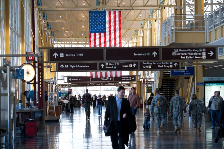A woman on a flight to Ronald Reagan Washington National Airport claims she was discriminated against when a flight attendant refused to give her an unopened can of soda. (Examiner file)