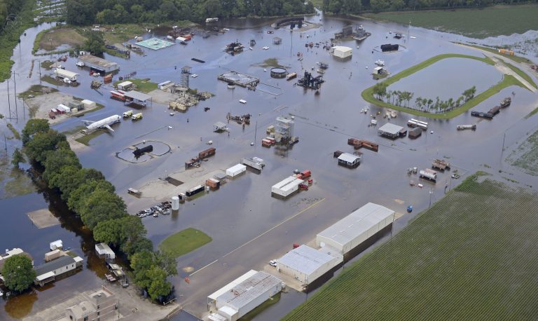 Now we have flooding in Louisiana, and where is President Obama? On vacation and golfing. (AP Photo)