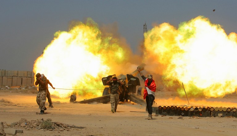 Iraqi security forces and allied forces fire artillery during the fight against Islamic State militants in Iraq. A top U.S. ground commander said, "The Iraqis are winning. To use a sports analogy they are 7 and 0." (AP Photo/Anmar Khalil, File)