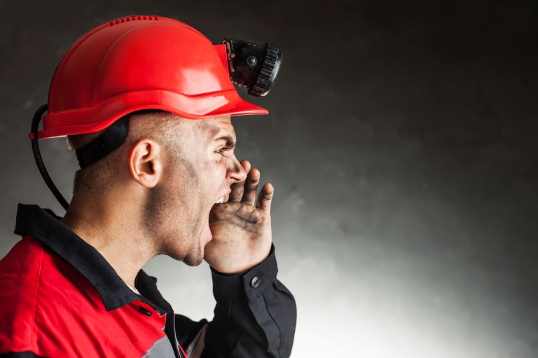 Two coal miners sent back bonus checks, with profanity scribbled on them. (iStock photo)