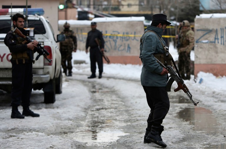 Security personnel stand guard at the site of a suicide attack on the Supreme Court in Kabul, Afghanistan, Tuesday, Feb. 7, 2017. A suicide bomber on Tuesday targeted the Supreme Court building in the Afghan capital. (AP Photo/Rahmat Gul)