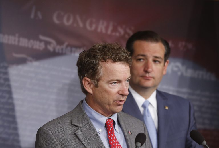 Sens. Rand Paul, R-Ky., and Ted Cruz, R-Texas, speak to reporters during a news conference about a military sexual assault bill on Capitol Hill in Washington on July 16. (AP Photo/Charles Dharapak)