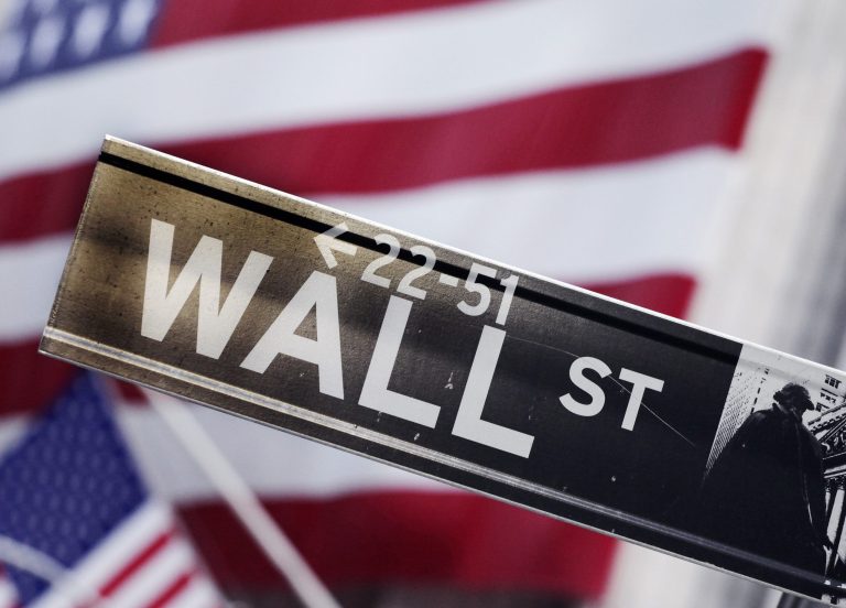 FILE - This Aug. 9, 2011 photo shows a Wall Street street sign near the New York Stock Exchange, in New York. (AP Photo/Mark Lennihan, File)