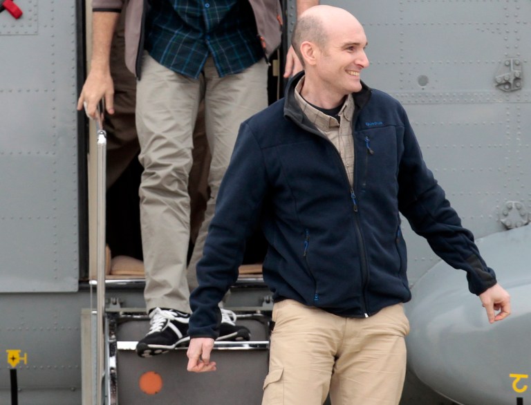 FILE - In this Sunday April 20, 2014 file photo, released French hostage Nicolas Henin arrives at the Villacoublay military airbase, outside Paris. A French journalist held hostage for months by extremists in Syria says one of his captors was a Frenchman suspected of killing four people at the Brussels Jewish Museum earlier this year. French magazine Le Point on Saturday, Sept. 6, 2014, quotes its reporter Nicolas Henin as saying he was tortured by Mehdi Nemmouche, a Frenchman who had spent time with extremists in Syria. Henin was held for a time with American journalists James Foley and Steven Sotloff, both beheaded by extremists from the Islamic State group in recent weeks. He was released in April with other French journalists who had been held since June 2013. Nemmouche is in custody since his arrest in France soon after the Brussels killing in May. The attack crystallized fears of European governments that Europeans who join radical fighters in Syria could return to stage attacks at home. (AP Photo/Jacques Brinon, file)