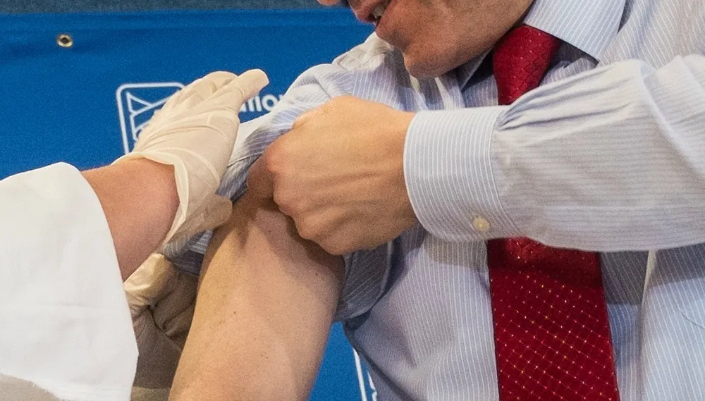 Feds battle doubts on flu shot