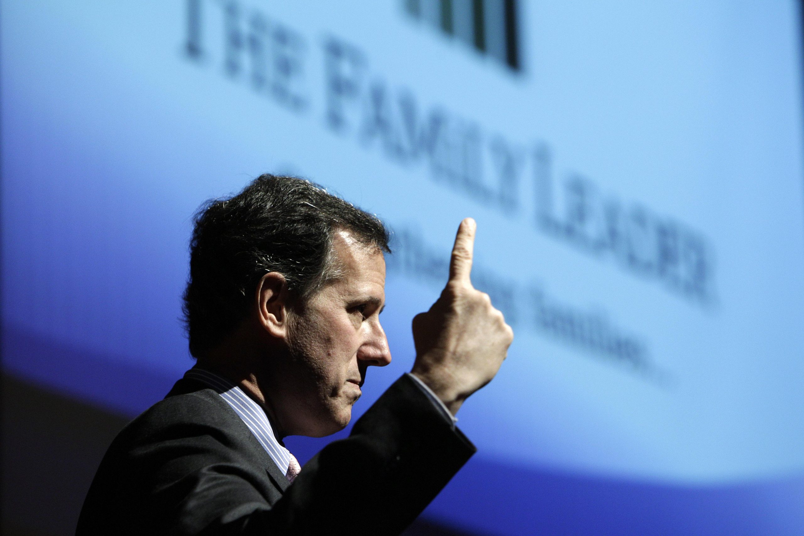 Perry, Santorum feud over legislating morality