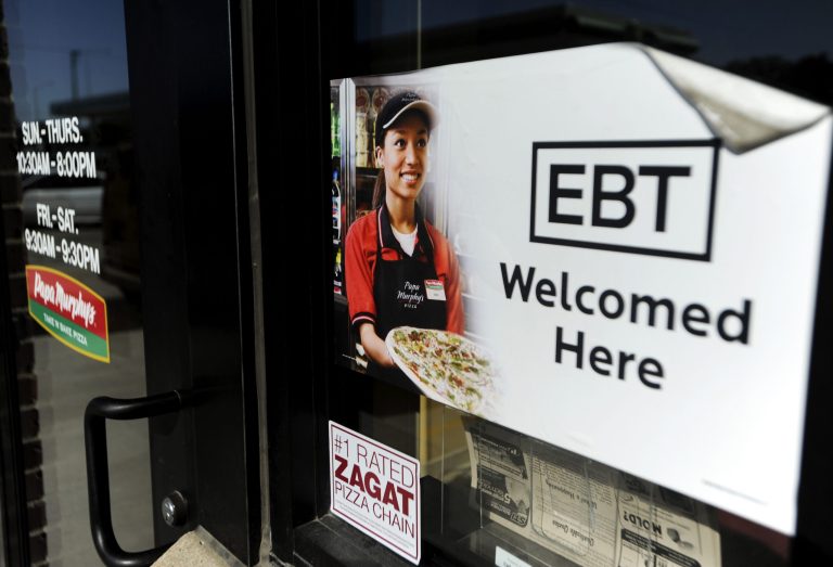 In this Aug. 26, 2011 photo, a sign notifies customers that EBT can be used at a store in Sioux Falls, S.D. House and Senate negotiators are set to begin crafting a compromise farm bill, including cuts to the food stamp program. The talks open Wednesday, Oct. 30, 2013, just two days before food stamp recipients will see a separate, unrelated cut in their monthly benefits. (AP Photo/The Argus Leader, Jay Pickthorn)